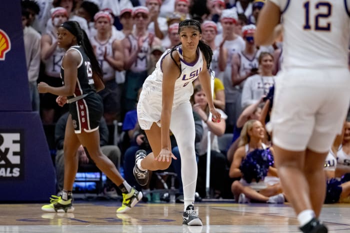 LSU Lady Tigers forward Angel Reese celebrates after a made shot.